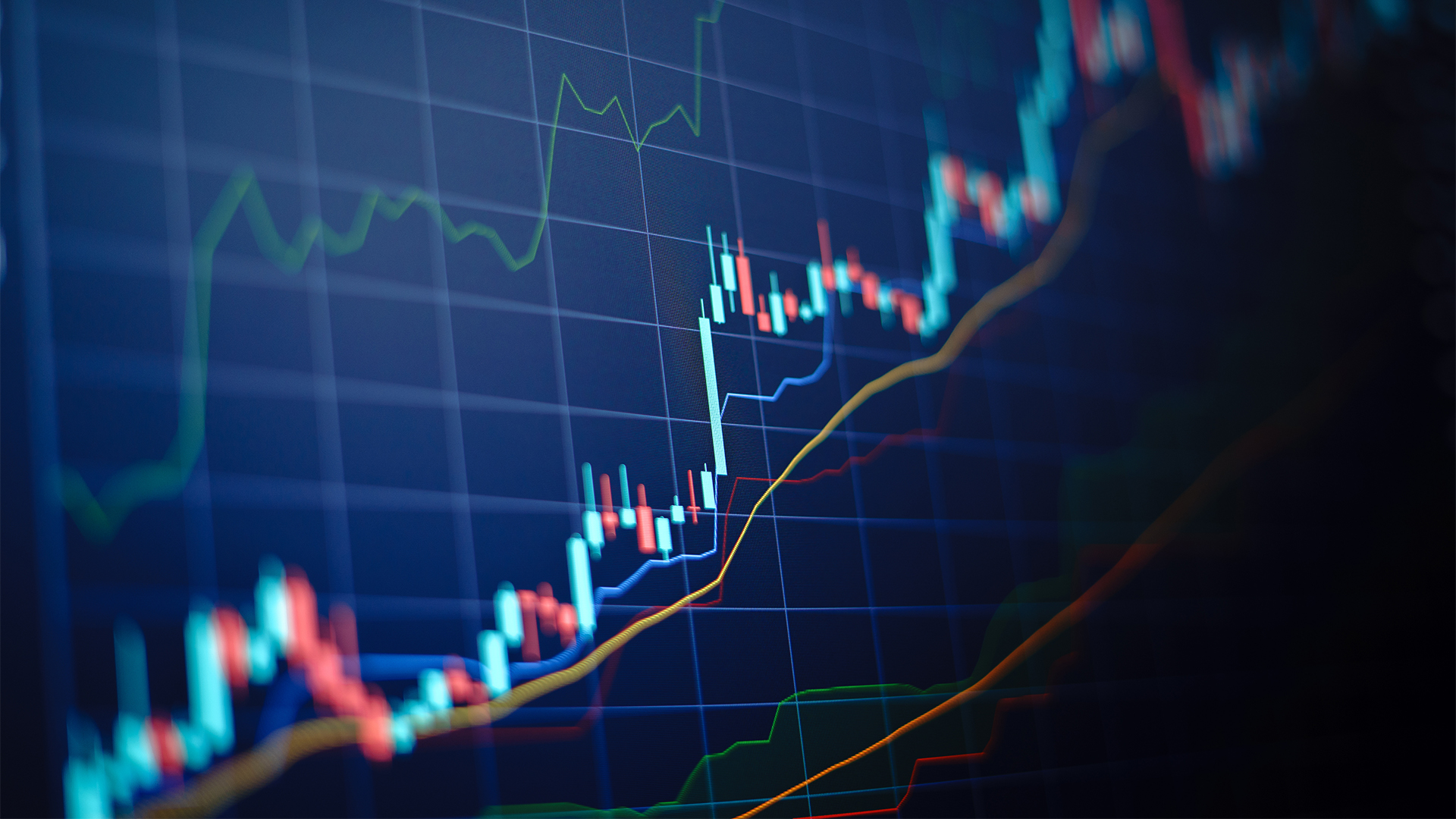 Closeup financial chart with uptrend line candlestick graph in stock market on blue color monitor background